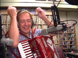 Gary Sredzienski plays accordion on air at WUNH radio